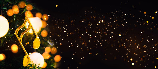 Christmas tree with note melody song decoration.banner background.Caroling or Carolers singing.group singing carol song on celebration of christmas day in winter time.Church, music, choir.Concert.
