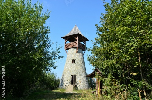 Lookout tower on Bobovec with blue sky, above the village of Stara Bystrica, Slovakia, Europe  view from the front zoom out. photo