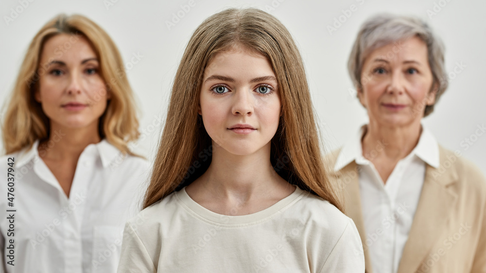 Selective focus of girl before mother and grandma
