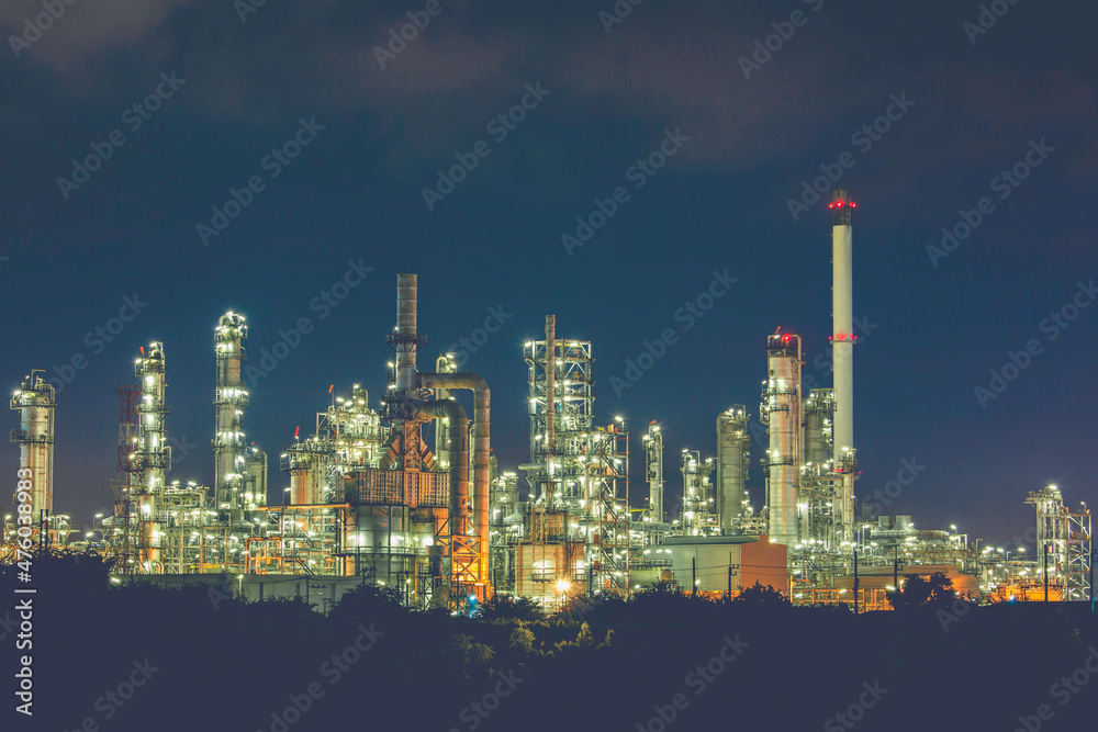 Oil​ refinery​ and​ plant and tower of Petrochemistry industry in oil​ and​ gas​ ​industry with​ cloud​ blue​ ​sky the night