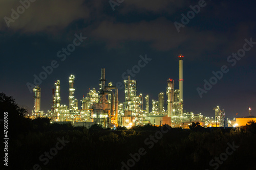 Oil​ refinery​ and​ plant and tower of Petrochemistry industry in oil​ and​ gas​ ​industry with​ cloud​ blue​ ​sky the night