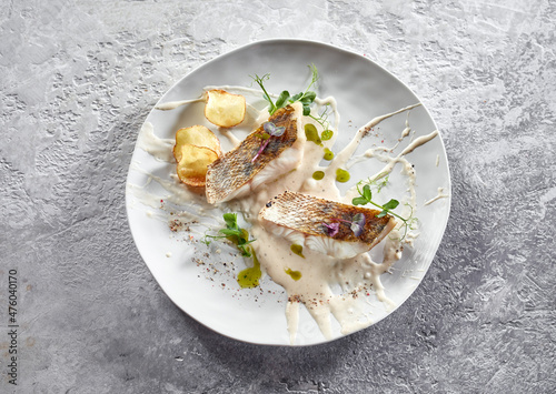 Fototapeta Naklejka Na Ścianę i Meble -  Appetizing fish fillet with sauce and fried potato