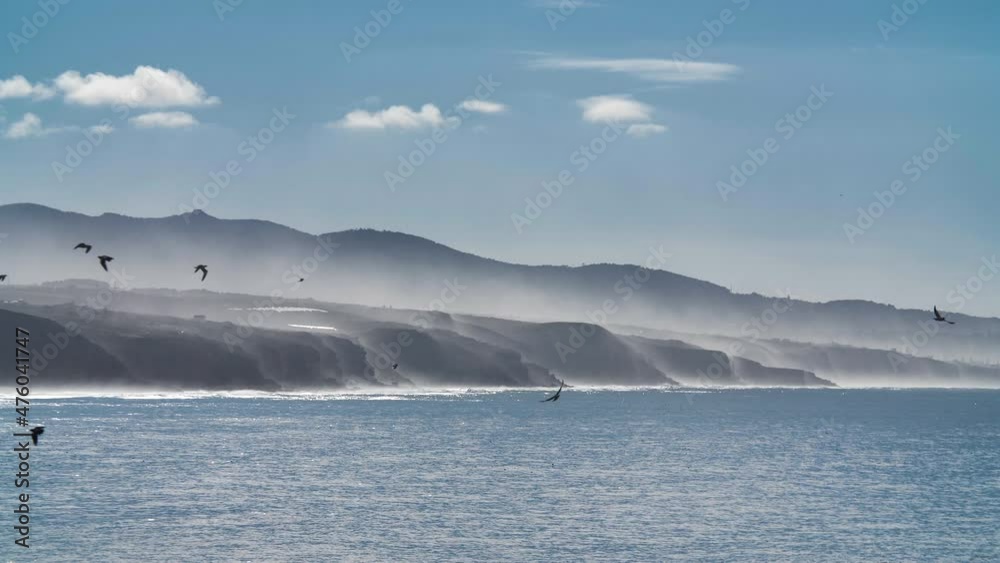 Hills with fog and calm sea Hills with fog and calm sea