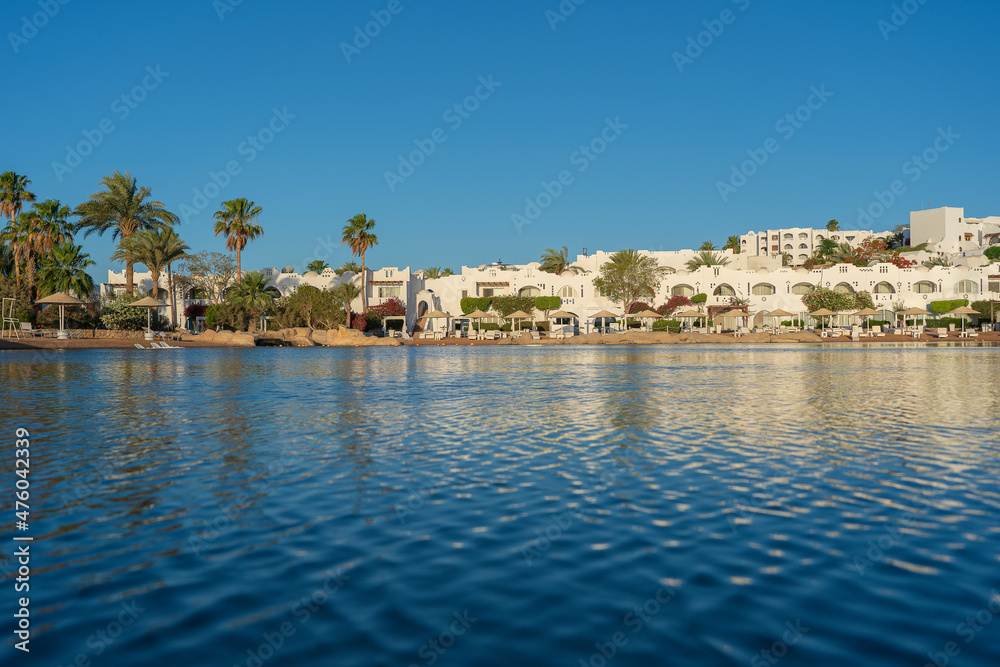 Calm beach on the red sea of Sharm El Sheikh during sunrise, Egypt