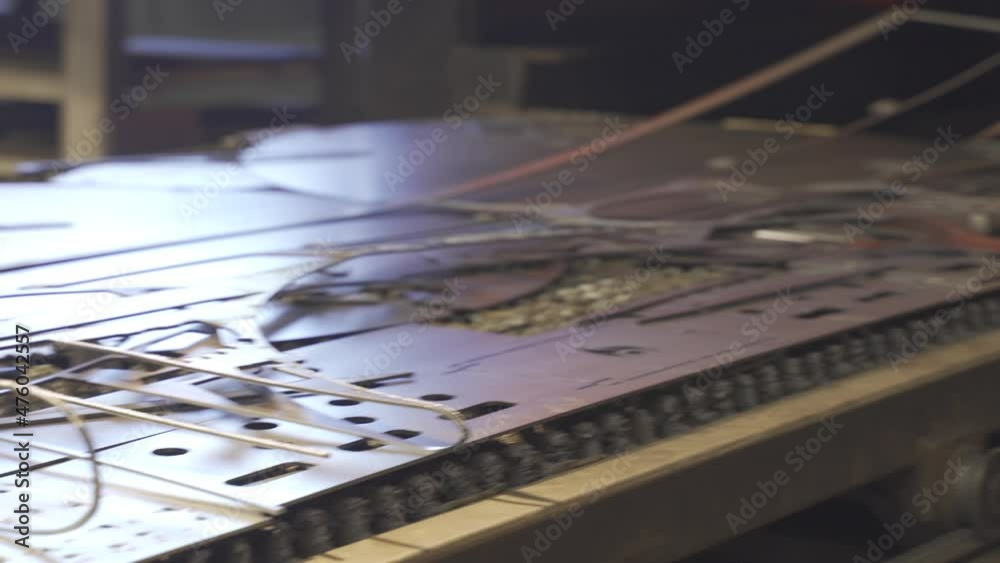 Worker folding flat metal sheet. Steel production at metallurgical plant. 4K Worker folding flat metal sheet. Steel production at metallurgical plant. 4K