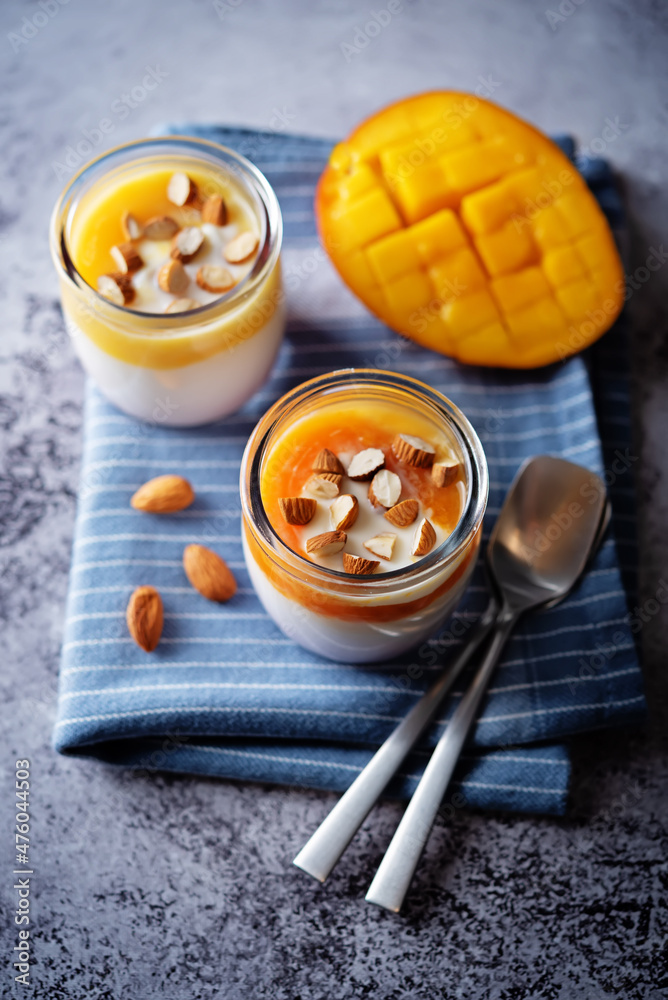 Fototapeta premium Greek yogurt mango healthy breakfast in a jar