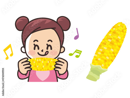 トウモロコシを食べる女の子
