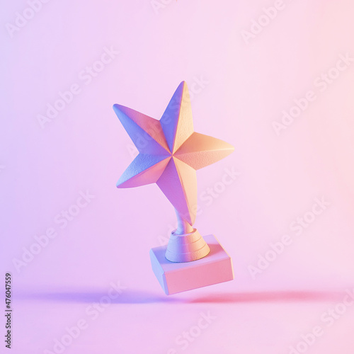 Five pointed star trophy award on pink background