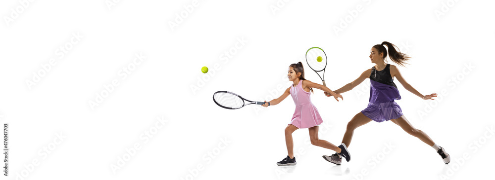 Sport collage. Woman, professional tennis player and little girl, beginner training together isolated over white studio background Sport collage. Woman, professional tennis player and little girl, beginner training together isolated over white studio background
