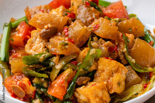 Kikil or cow skin with spicy flavors is minang cuisine of West Sumatra, Indonesia. Kikil Cooked using Indonesian herbs, such as red chilies, shallots, garlic, tomatoes, etc. 