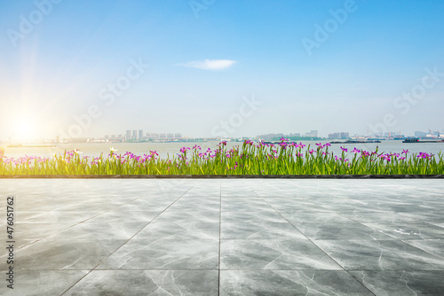 In spring, the flower beds on the side of the stone square in the park