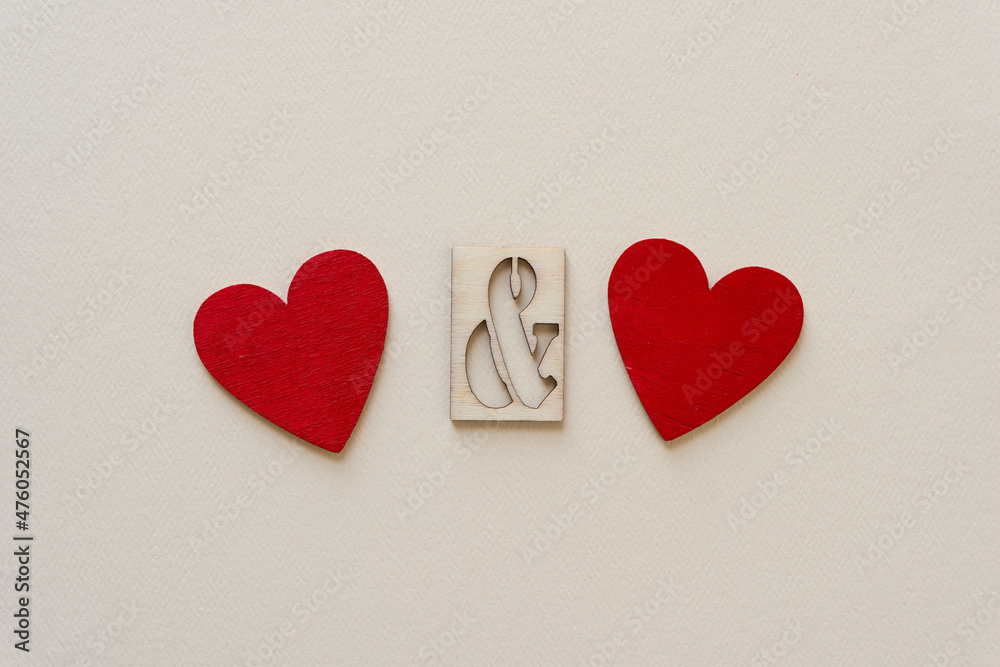 two grungy red hearts and a stencil ampersand