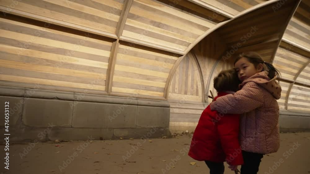 A little boy and girl on hug Two smiling,curly,cute baby-girl and boy hug tightly each other.True friendship, friends for ages.Playing,happy childhood, positive emotions, true feelings.