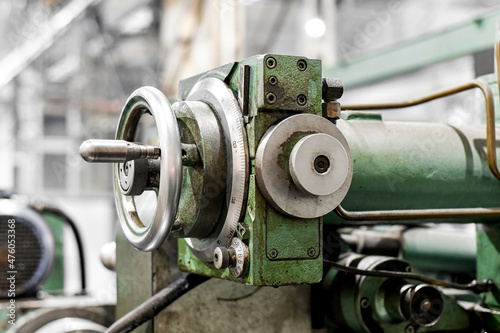 In the workshop there is a feed control mechanism on the machine.
