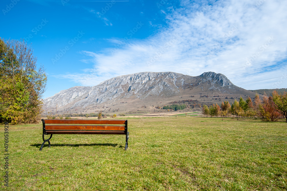 bench with a view to piatra secuiului mountain, romania, near rimetea