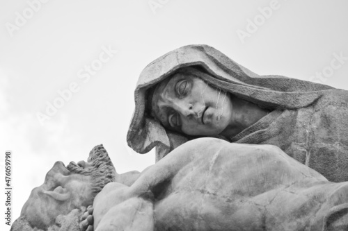 Grayscale closeup shot of a religious statue in Valley of the Fallen in Spain photo
