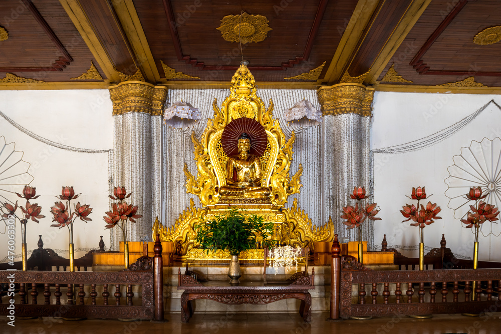 Shwenandaw Monastery, Mandalay, Myanmar - view of a buddha statue in an altar