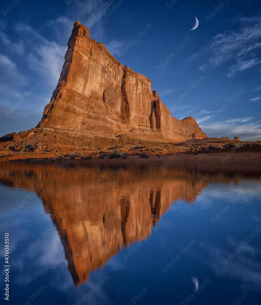 red rocks in arches national park water reflections