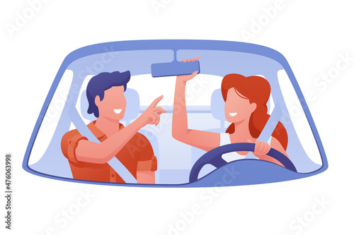 Man and woman ride on trip in car laughing