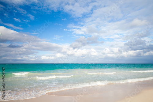 Coastal Caribbean landscape with empty sandy coast and waves © evannovostro