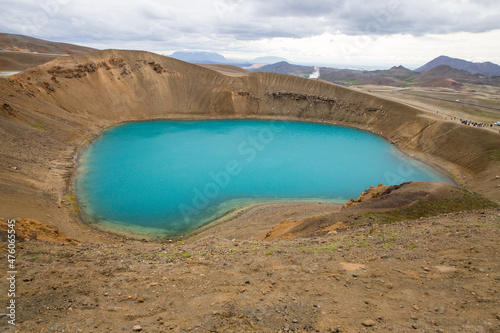 Majestic Viti crater in Krafla volcanic area, Iceland. Typical Icelandic nature landscape. Great view of the azure lake in Viti crater. Iceland is the country of many volcanos, and Glaciers.