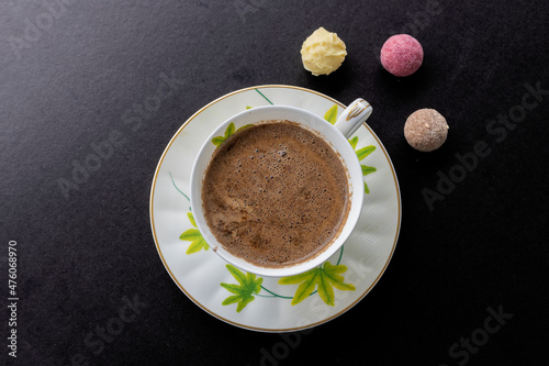 Chocolate and turkish coffee on black background