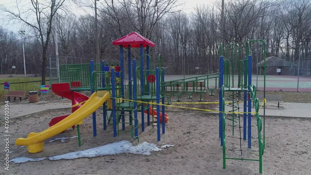 Mid air panning from right to left showing closed playground due to Covid-19 Mid air panning from right to left showing closed playground due to Covid-19