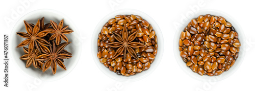 Star anise fruits and seeds in white bowls. Known as staranise, star aniseed or badian. Dried, star-shaped pericarp and seeds of Illicium verum, containing anethole, a spice with intense anise flavor.