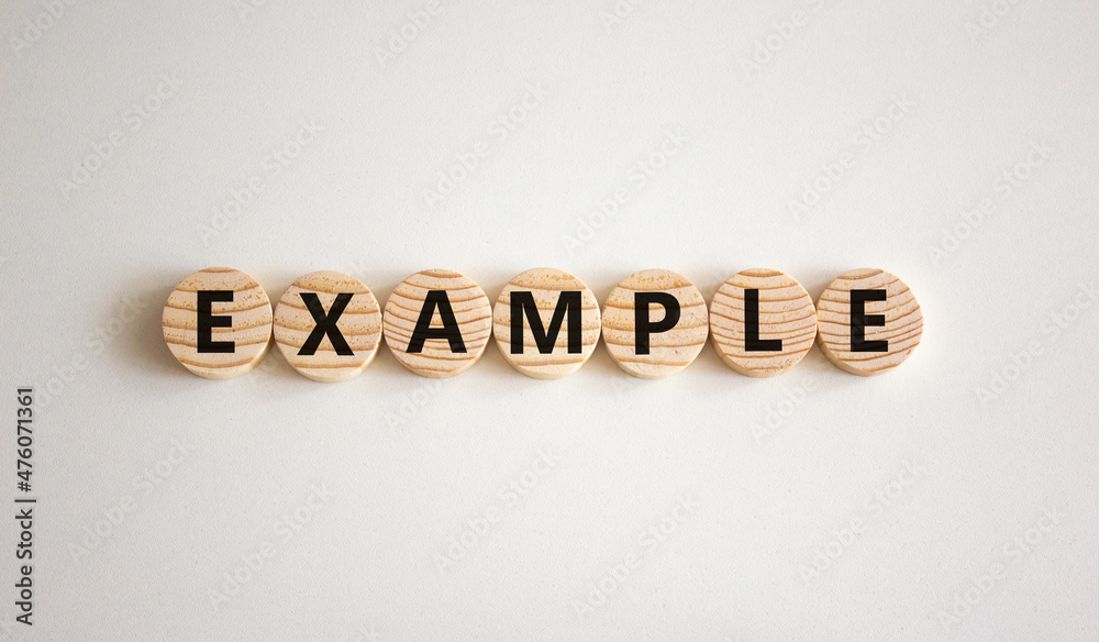 Example symbol The concept word Example on wooden circles Beautiful