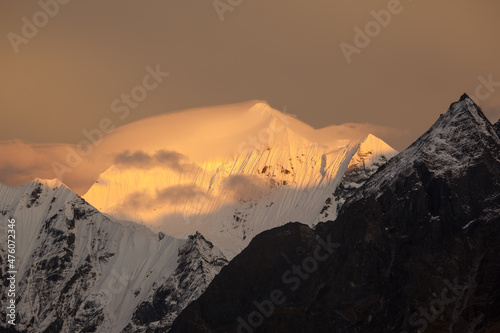 views of snow-capped mountain peaks at sunset in lantang. Kyanjin Gompa