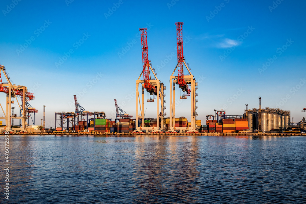 Fototapeta premium cranes and containers in the seaport