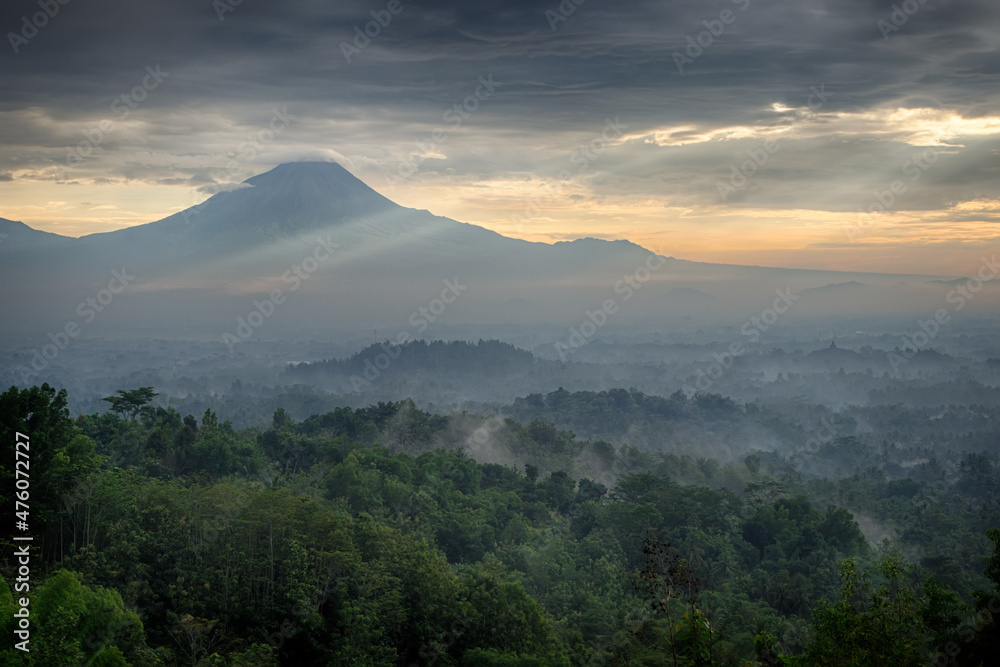 Foggy dawn over Merapi and Borobudur