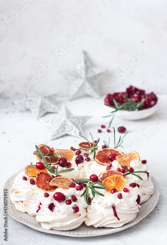  Meringues pavlova cake wreath with whipped cream, pomegranate and orange