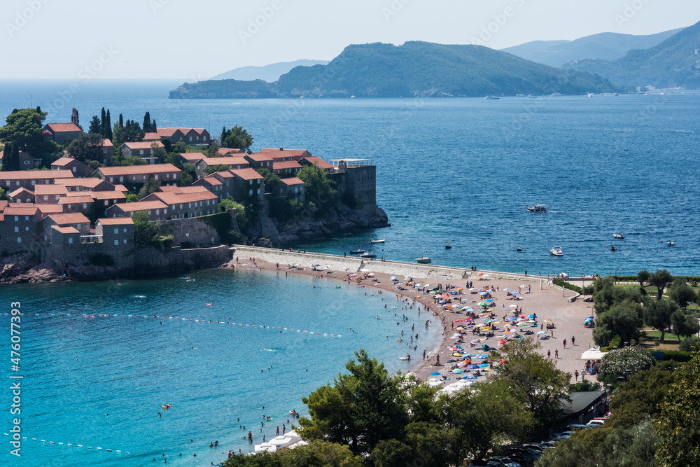 beautiful view of the beach and island Sveti-Stefan near Budva in Montenegro, Europe, Adriatic Sea and mountains
