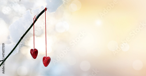 Red hearts on snowy tree branch in winter. Holidays happy valentines day. Love concept. © Belight