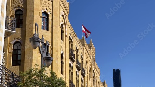 Lebanese flag waving on top of a building in downtown Beirut - Lebanon
 photo