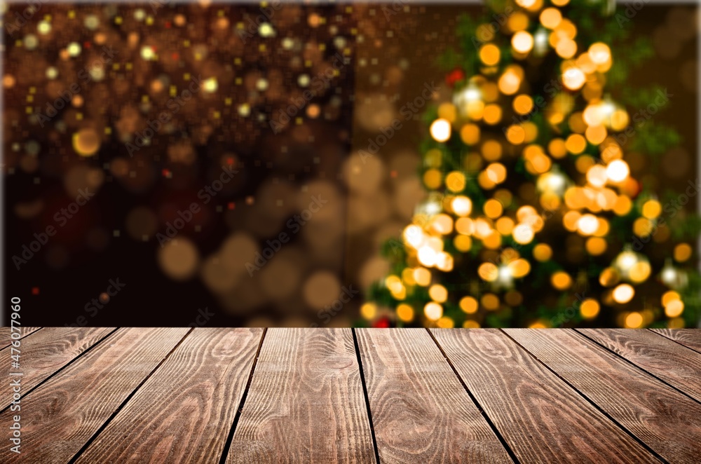 Empty table in front of christmas tree with decorations background. For product display montage Empty table in front of christmas tree with decorations background. For product display montage