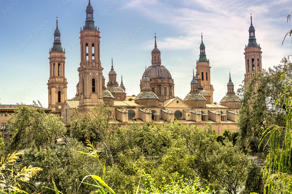 Zaragoza – view of The Basilica del Pilar through the trees. Spain