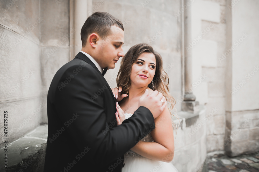 Sensual portrait of a young wedding couple. Outdoor