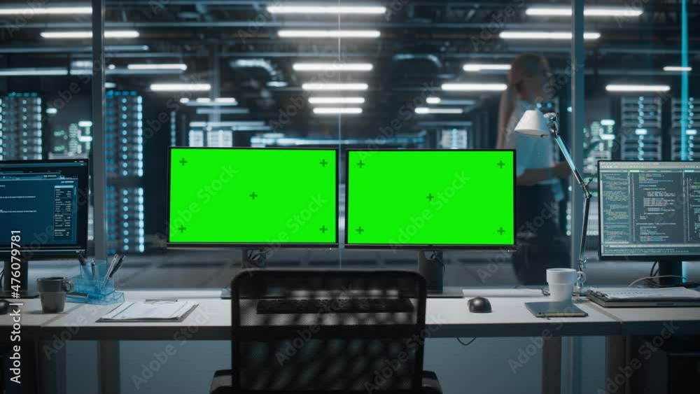 High-Tech Data Center Server with Two Green Screen Chroma Key Display Showing on Personal Computer Standing on a Desk. Concept of Modern Monitoring Web Services, Cloud Computing, Cyber Security
