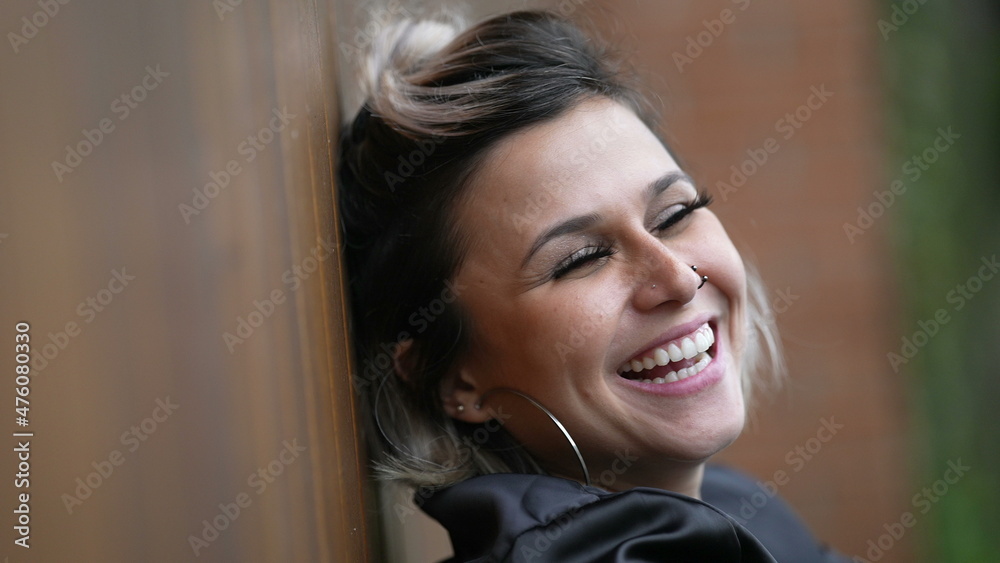 Woman spontaneous laugh. Person real life natural smile and happiness Woman spontaneous laugh. Person real life natural smile and happiness