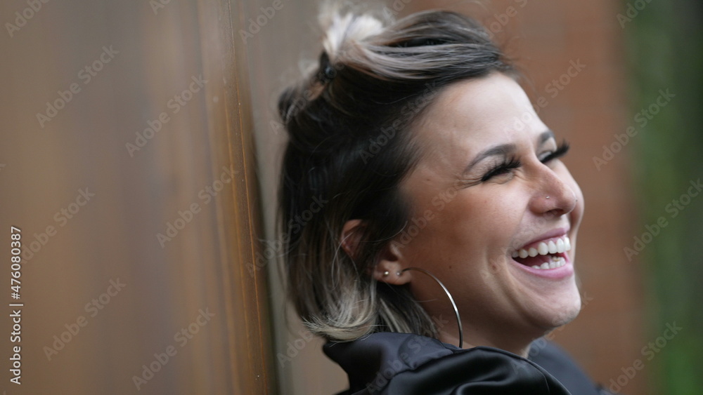 Woman spontaneous laugh. Person real life natural smile and happiness Woman spontaneous laugh. Person real life natural smile and happiness