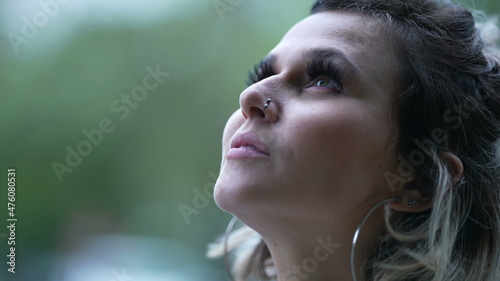 Woman looking up at sky smiling with HOPE and FAITH
