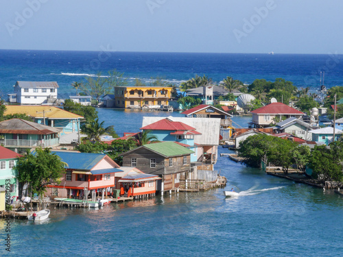 Aerial view of many houses along the canal on Roatan Island in summer photo