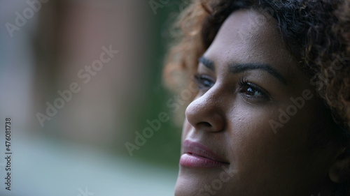 Pensive black woman, contemplative Brazilian girl close-up face in tranquility