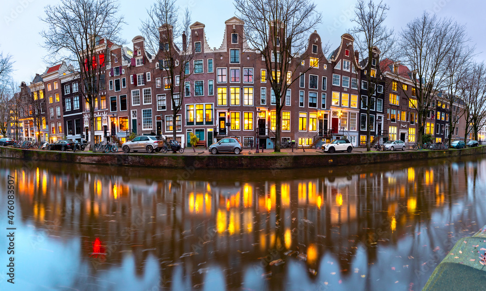 Panorama of evening Amsterdam canal Leidsegracht with typical dutch houses at gold hour, Holland, Netherlands.