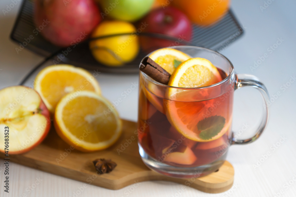 Fruit tea, various fruits in a basket on the table. Calendar 2022, winter mood and spruce branches. Fruit tea, various fruits in a basket on the table. Calendar 2022, winter mood and spruce branches.