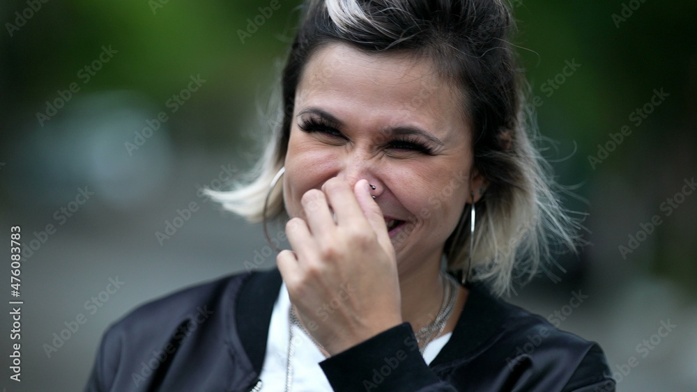 Woman spontaneous laughing and smiling. Person real life laugh and smile Woman spontaneous laughing and smiling. Person real life laugh and smile