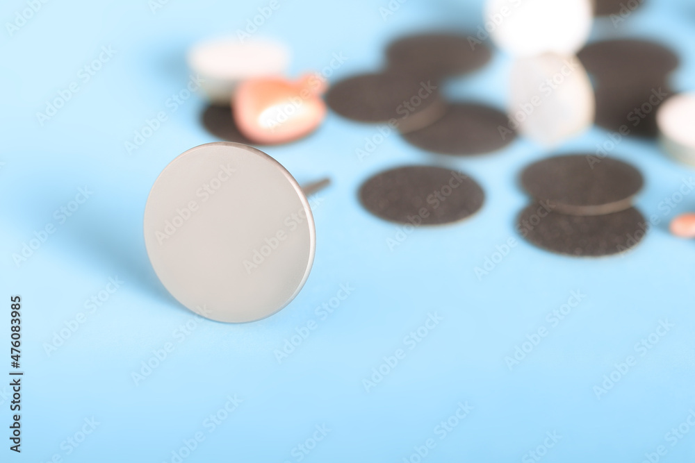 a metal disc for the treatment of feet in a pedicure lies on a bright background a metal disc for the treatment of feet in a pedicure lies on a bright background