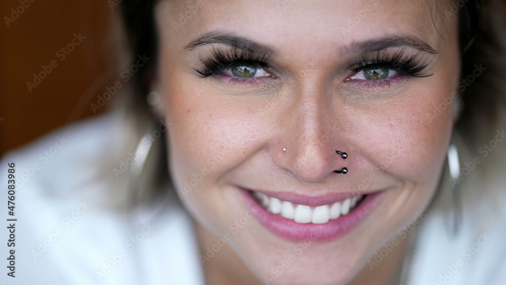 Naklejka premium Woman face smiling extreme close-up eyes and smile